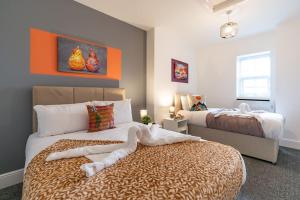 En eller flere senger på et rom på Jesouth Refreshing Condo Roomy Comfy Posh