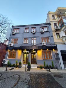 a building with a sign on the front of it at CLASS 17 PANSİYON in Çanakkale