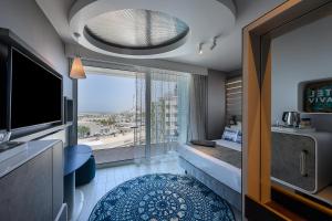 TV o dispositivi per l'intrattenimento presso Port Tower by Isrotel Design