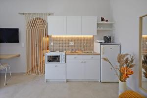 Kuchyňa alebo kuchynka v ubytovaní Spiliada Boutique Studios + 23 fotografií