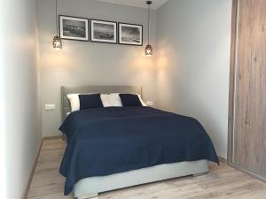 Łóżko lub łóżka w pokoju w obiekcie Apartament z basenem i klimatyzacją