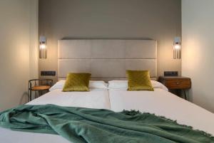 A bed or beds in a room at Apto rural Alesves Esencia de Bardenas Navarra