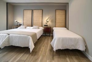 A bed or beds in a room at Apto rural Alesves Esencia de Bardenas Navarra
