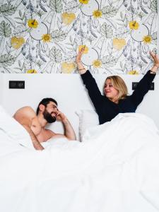 Posteľ alebo postele v izbe v ubytovaní Le Bras d'or Apparts et Spa