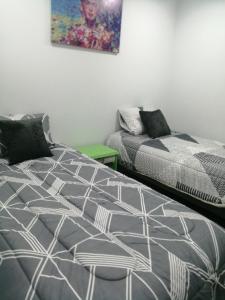 Ένα ή περισσότερα κρεβάτια σε δωμάτιο στο hostal mancora monjitas 755