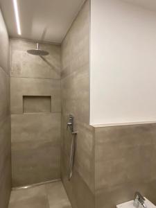a bathroom with a shower and a sink at Cosy Apartment Marlain-Self Check in in San Valentino alla Muta
