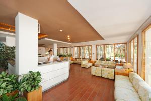 a lobby with couches and a bar in a building at Hotel Kyrie Isole Tremiti in San Domino