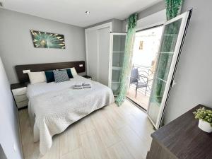 Postel nebo postele na pokoji v ubytování El Pont Alicante Apartments