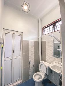 a bathroom with a toilet and a sink at Queen Room Semi Attached Bathroom Bukit Mertajam Alma Impian in Bukit Mertajam