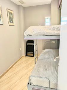 Postel nebo postele na pokoji v ubytování El Pont Alicante Apartments