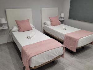 En eller flere senge i et værelse på Apartamentos Bluebelle - Marbella