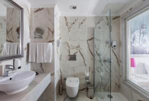 a bathroom with a sink toilet and a shower at Sultan of Dreams Hotel & Spa in Kızılot