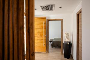 a room with a door leading to a bedroom at Casa Lina in Borgo