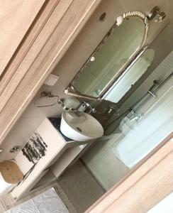 Koupelna v ubytování By The Sea + 37 fotografií