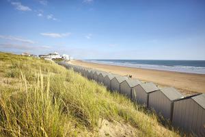 a fence on a beach with the ocean at Saint Gilles - Appart 4 personnes - 600m des quais in Saint-Gilles-Croix-de-Vie