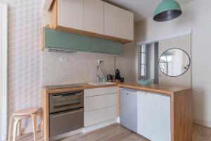 Kuchyňa alebo kuchynka v ubytovaní Appartement confortable au cœur de Nantes + 9 fotografií
