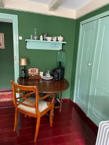 a dining room with a table and a chair at B&B Suupmarkt in Dokkum