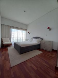 Кровать или кровати в номере Cabedelo Beach Apartment