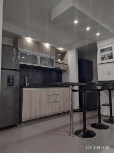 Kuchyň nebo kuchyňský kout v ubytování Berilo Deluxe Apartahotel