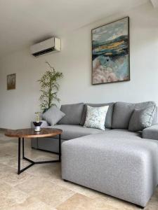 a living room with a couch and a table at Ipana C306 in Playa del Carmen