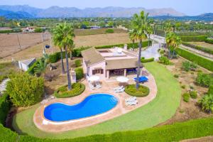an aerial view of a house with a swimming pool at Villa Bauza by Villa Plus in El Port