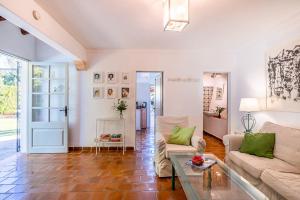 A seating area at Villa Rafaleta by Villa Plus
