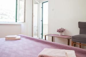 Letto o letti in una camera di Mimice View