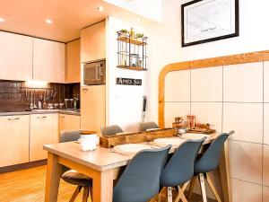 a dining room with a table and chairs at Large 2-Bedroom Apartment, Centre of Flaine Foret in Flaine
