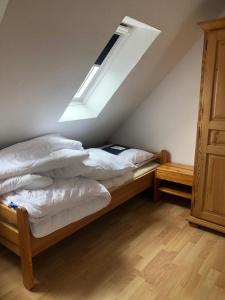 Postel nebo postele na pokoji v ubytování Moin im schönen Friesenhof