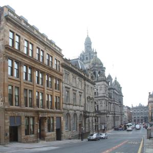 a row of buildings on a city street at The Z Hotel Glasgow in Glasgow