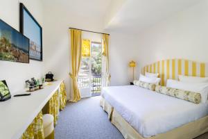 Postel nebo postele na pokoji v ubytování Hôtel Le Y