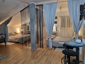 Postel nebo postele na pokoji v ubytování Apartman Atelier
