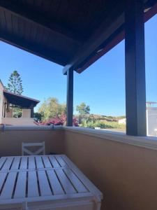 a balcony with a bed and a view of the ocean at Casa stella marina in Campomarino