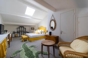 Postel nebo postele na pokoji v ubytování Hôtel Le Y