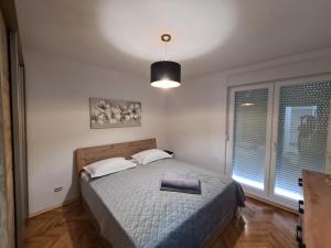 Posteľ alebo postele v izbe v ubytovaní “Perla”-sibenik