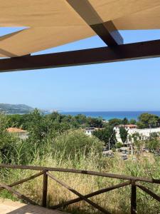 a view of the ocean from the balcony of a house at Panoramic Beach Villa in Zambrone