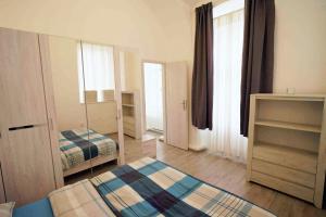 Posteľ alebo postele v izbe v ubytovaní Apartmán U kostela