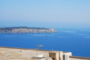 a view of a large body of water at sunrise flats in Mellieħa