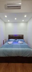Posteľ alebo postele v izbe v ubytovaní Piazza Colombo-Apartments