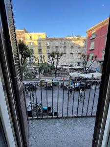una vista de una ciudad desde un balcón en bellini holiday home, en Nápoles