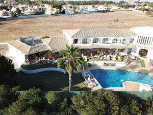 an aerial view of a house with a swimming pool at FLOR DO VALE - APARTAMENTOS TURISTICOS in Guia
