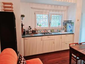 a kitchen with a sink and a counter top at Eva Luna in Ostuni