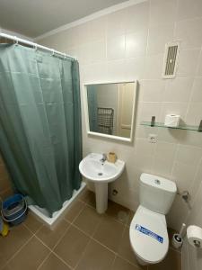 a bathroom with a toilet and a sink and a shower at Las Lomas - Apartamentos in Costa Calma