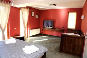 A television and/or entertainment centre at Villa Ema
