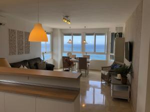 a living room with a view of the ocean at Velilla Apartment “Sun&Sea” in Almuñécar
