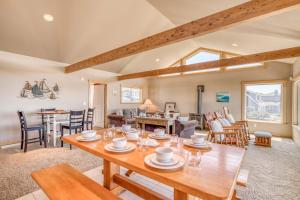 a living room with a wooden table and chairs at Sea-Esta in Tierra Del Mar - Meredith Lodging in Tierra Del Mar