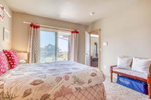 a bedroom with a large bed and a window at Sea-Esta in Tierra Del Mar - Meredith Lodging in Tierra Del Mar