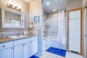 a bathroom with a sink and a toilet and a shower at Sea-Esta in Tierra Del Mar - Meredith Lodging in Tierra Del Mar +31 photos