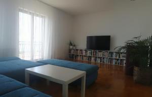 Televízia a/alebo spoločenská miestnosť v ubytovaní Island view