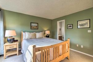 a bedroom with a wooden bed with green walls at Winter Park Condo on Bus Route, 2 Blocks to Dtwn! in Winter Park +37 photos